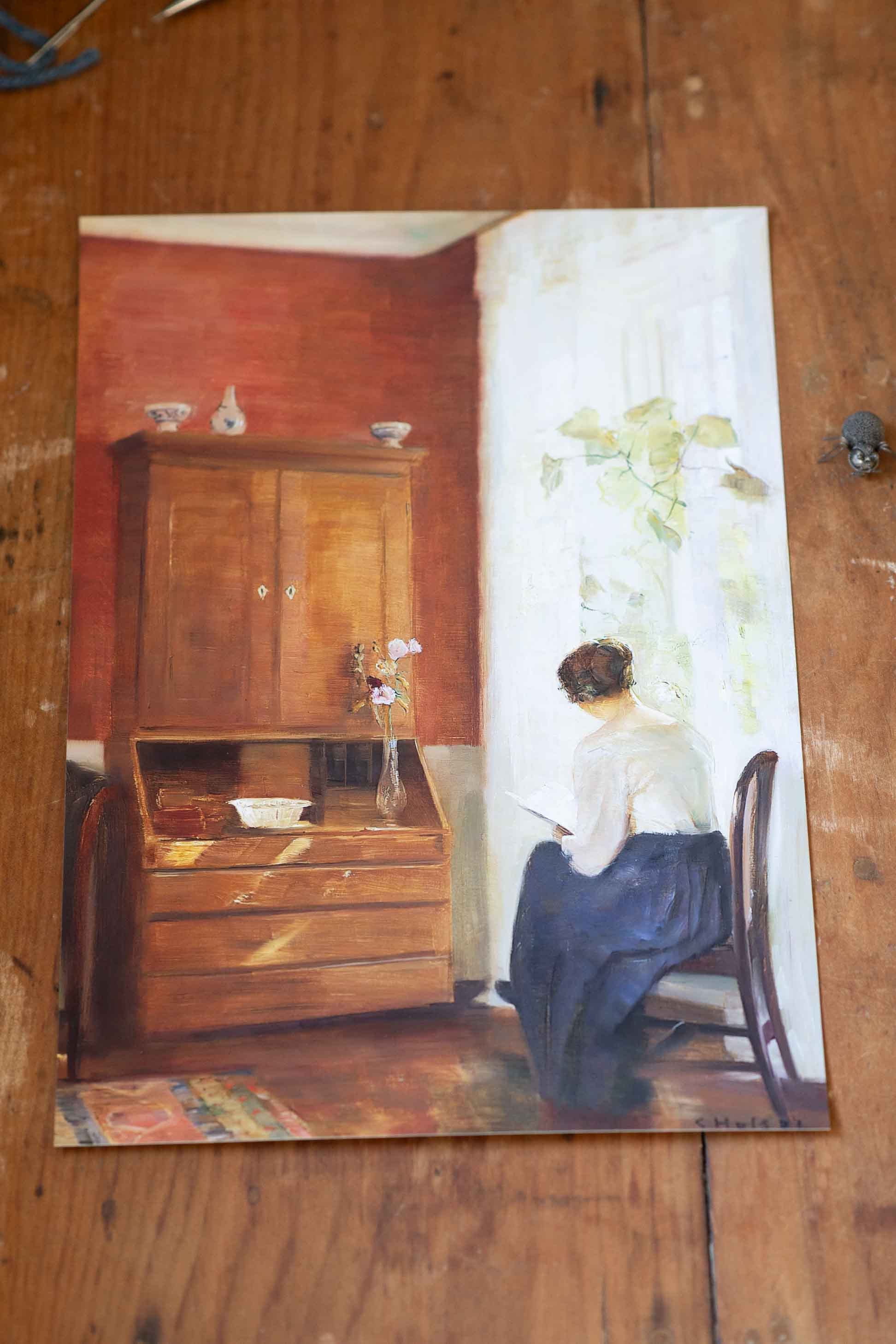 Art print of woman reading by window. DSC4163