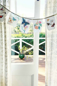 Butterfly garland hanging in window