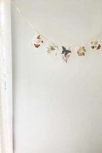 Butterfly garland on a white wall