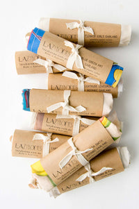 Garlands, various styles wrapped in paper and tied with ribbon.