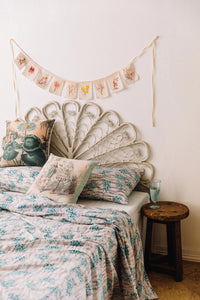Summer top sheet, botanical cushions, garlands, & vintage tea decor