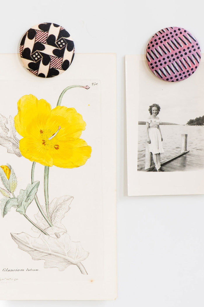 Fridge magnets holding art and photo