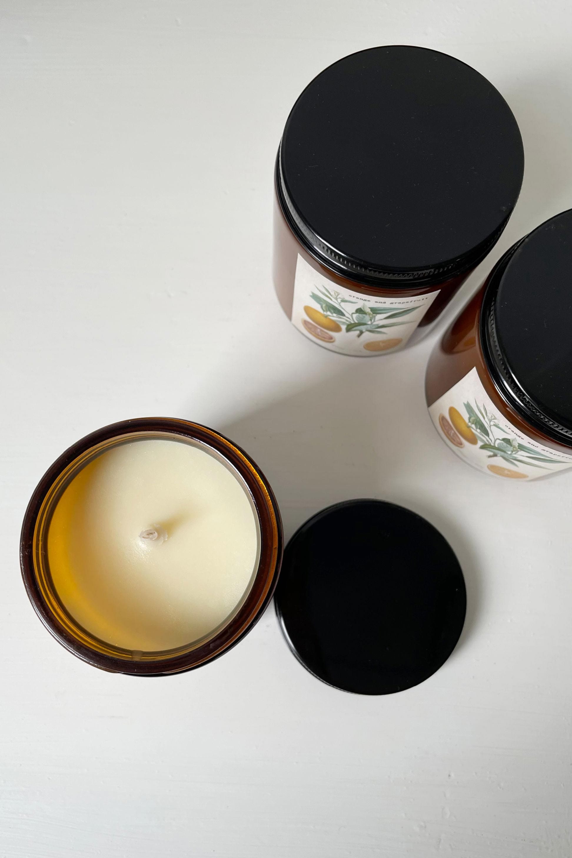 Orange Grapefruit Candle, close-up of three candles