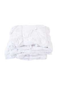 White quilt with textured design