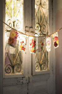 Vintage flower garland hanging on door