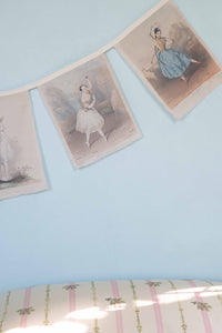 Ballerina garland on blue wall