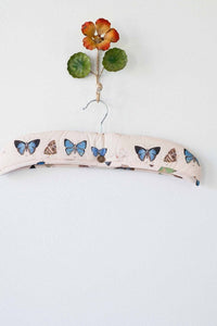 Butterfly-decorated clothes hanger