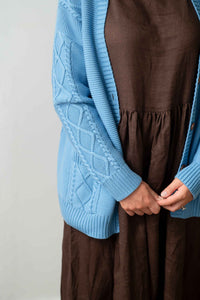 CharliLichenElizaChicory - Blue cable knit cardigan & brown dress