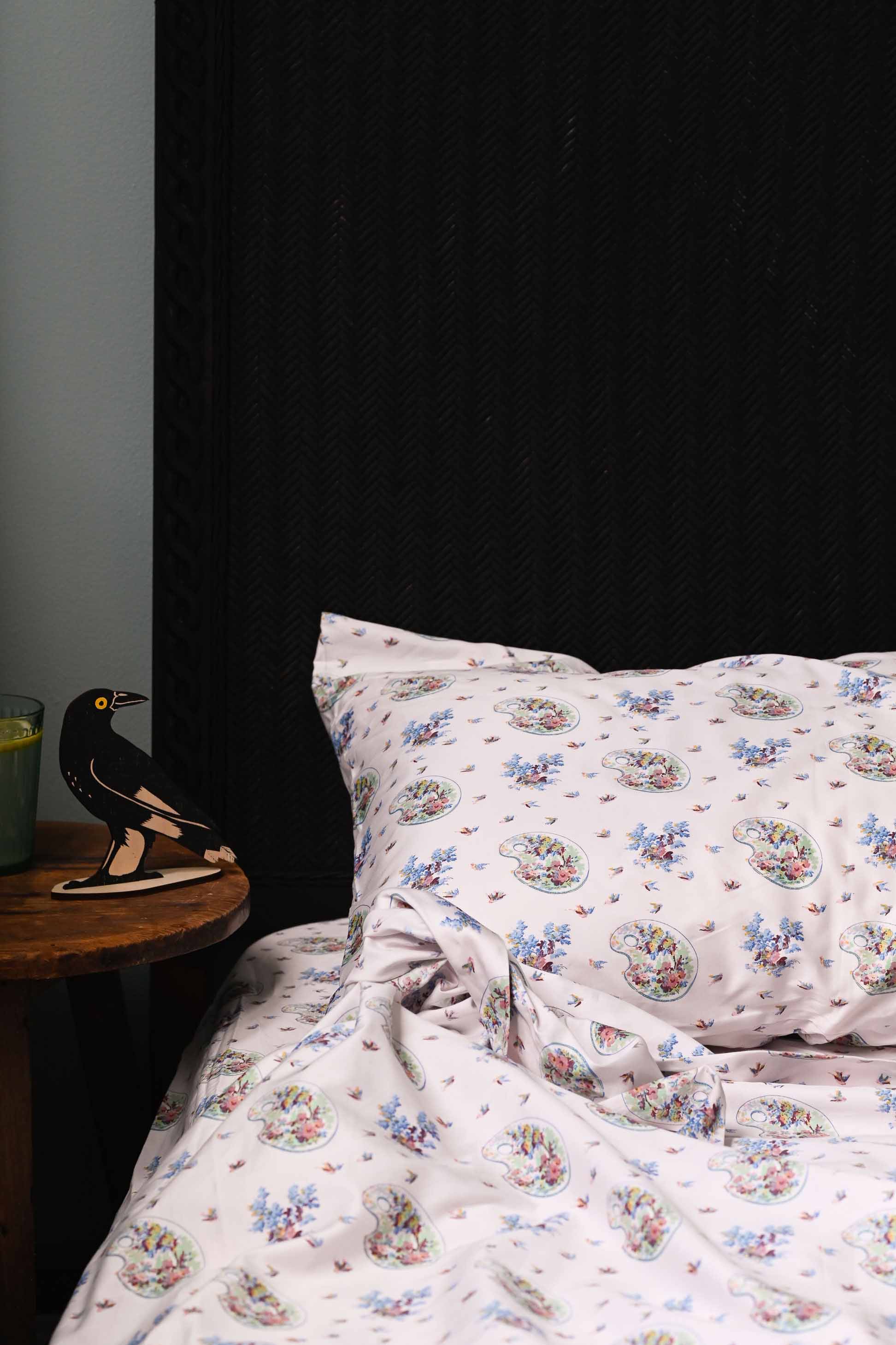 Currawong bed sheets with swallows and floral pattern