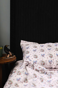 Currawong bed sheets with swallows and floral pattern