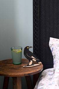 Currawong stand with glass of water and bed detail