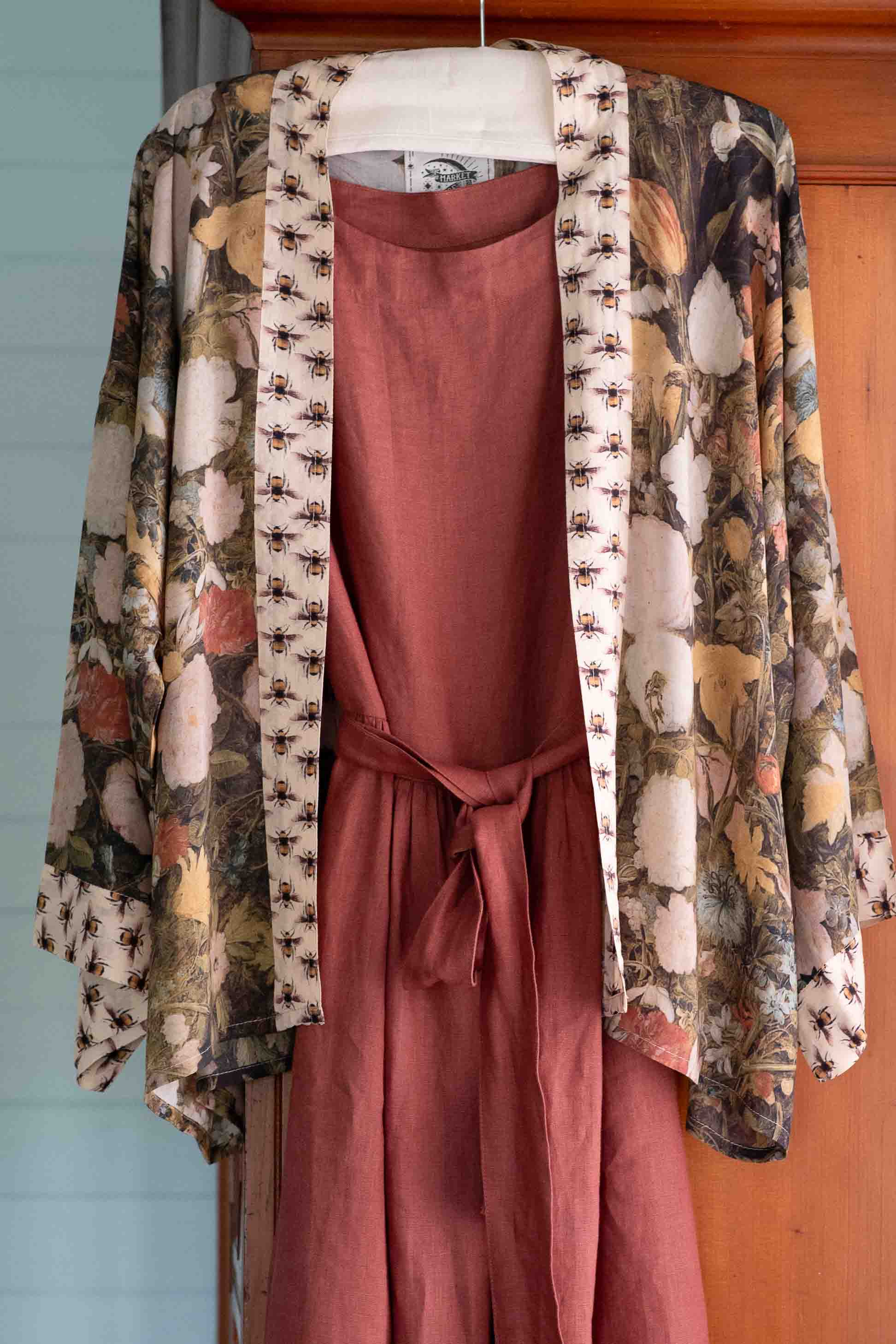 Floral kimono jacket over rust-colored dress