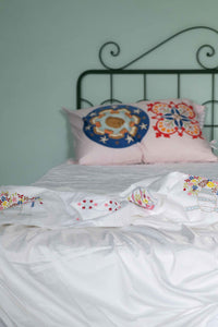 Bedroom with embroidered pillows and bedding - DSC4656