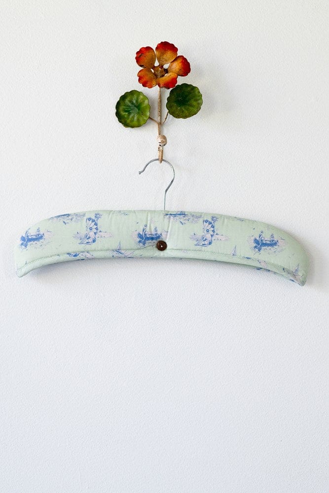 Decorative padded hanger with floral accent