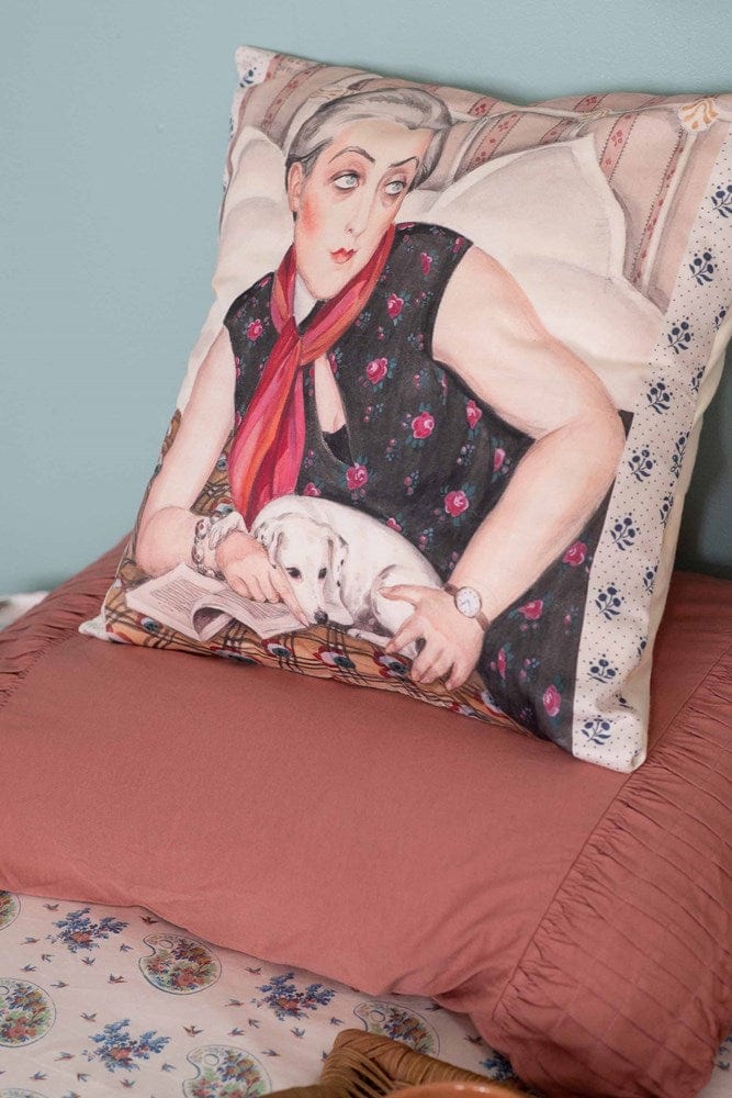 Decorative pillow with woman and dog artwork