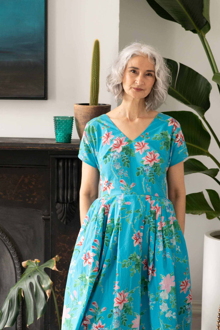 Ella Bluesette in floral blue dress.