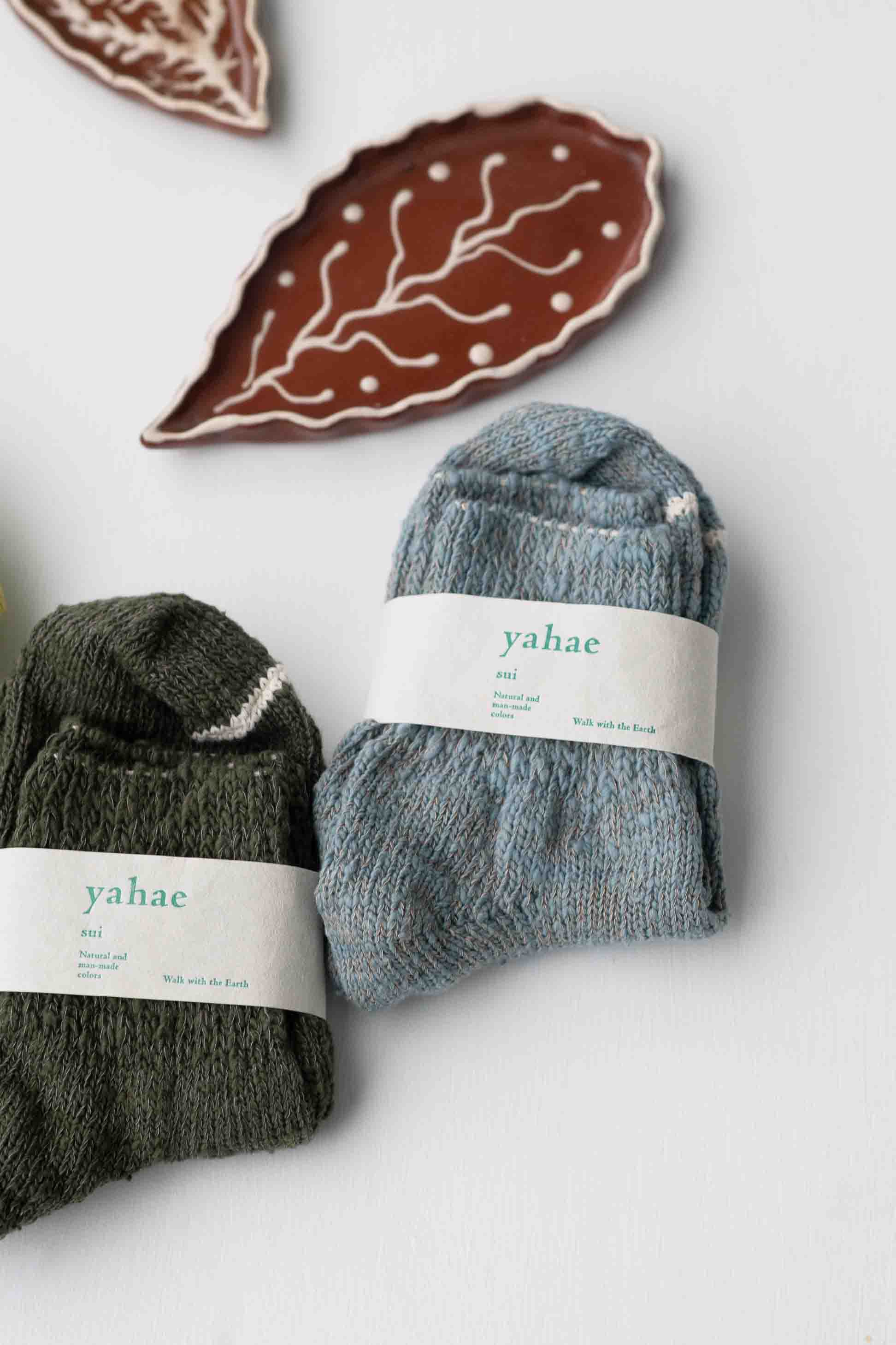 GarabouSocks yahae socks, olive and blue, with leaf decor.