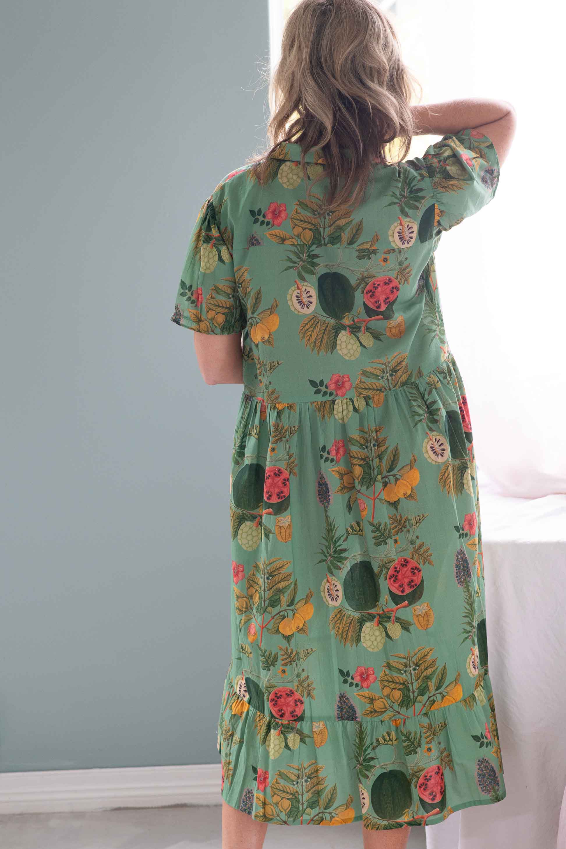 Woman in Georgia Tropics floral dress