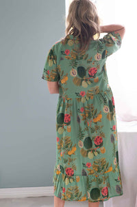 Woman in Georgia Tropics floral dress