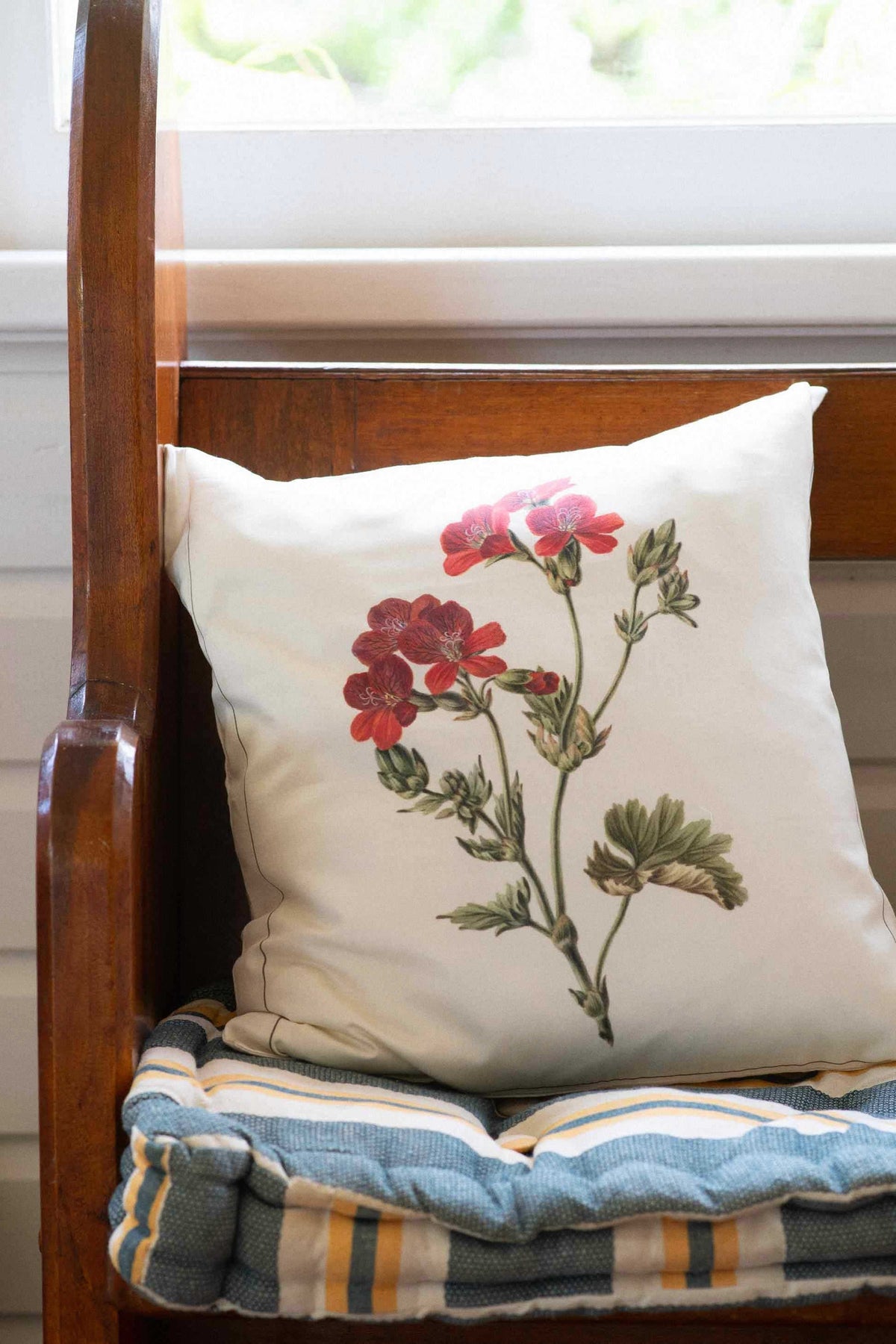 Geranium cushion on bench