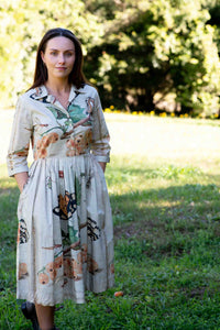 Gianna in insect print dress outdoors