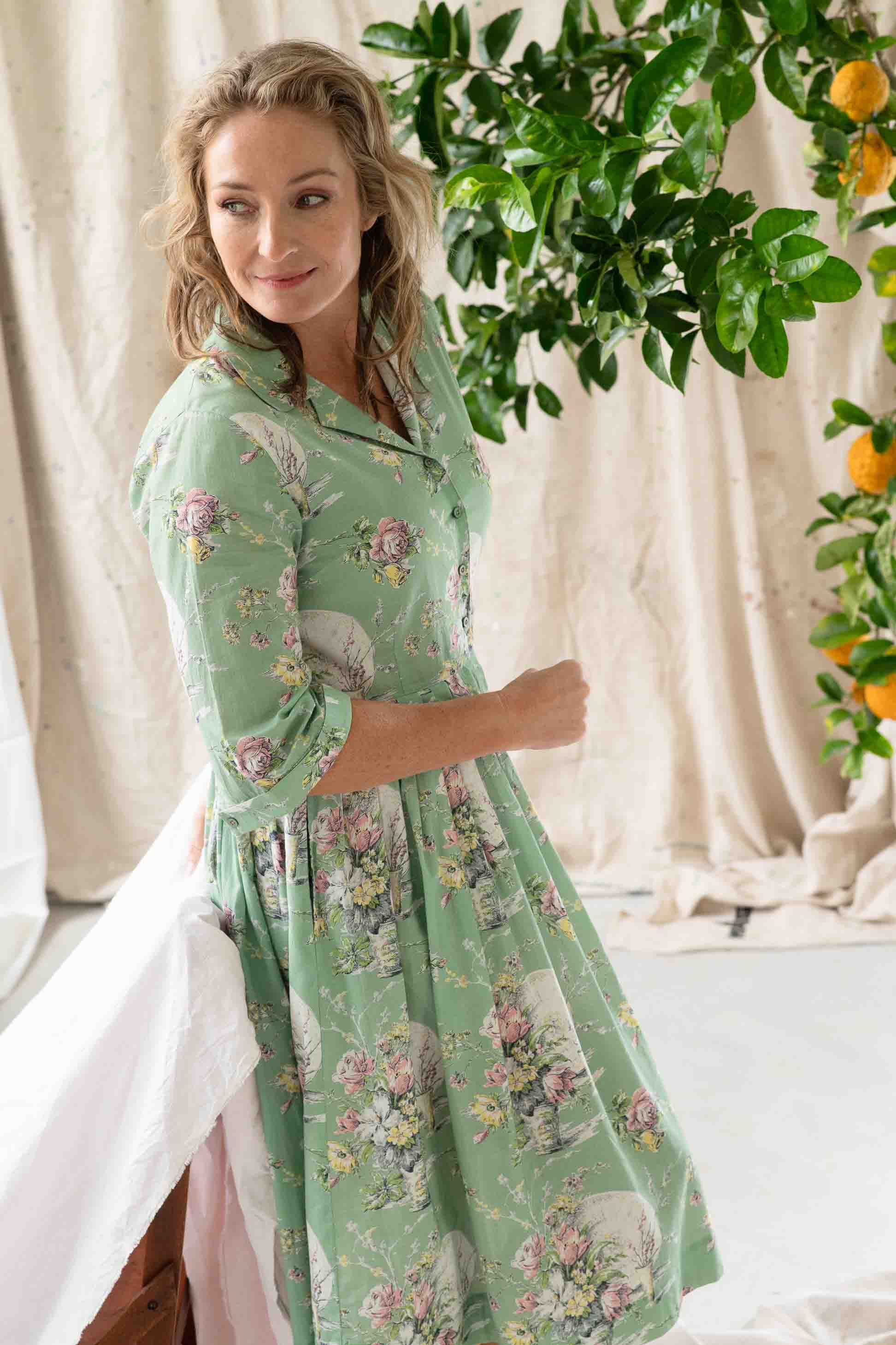 Gianna Newlyn in floral green dress