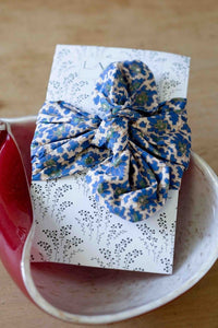 Bluebell floral wrapped gift in red dish