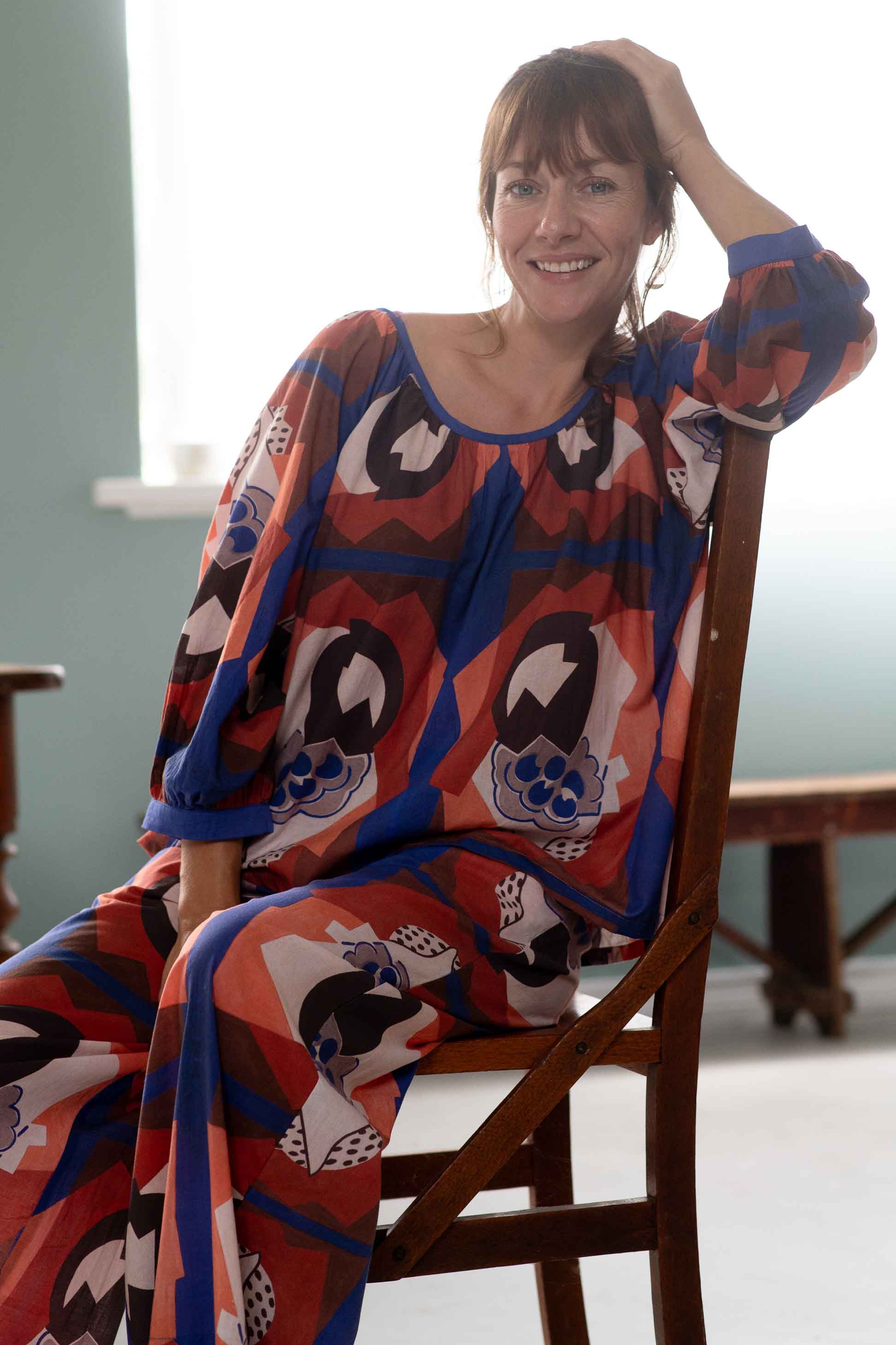 Woman in patterned Hetti top and pants, Ollie composition