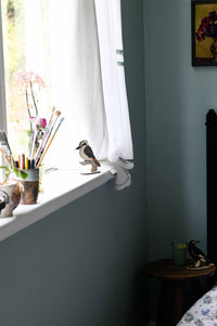 Kookaburra & Currawong figurines on windowsill