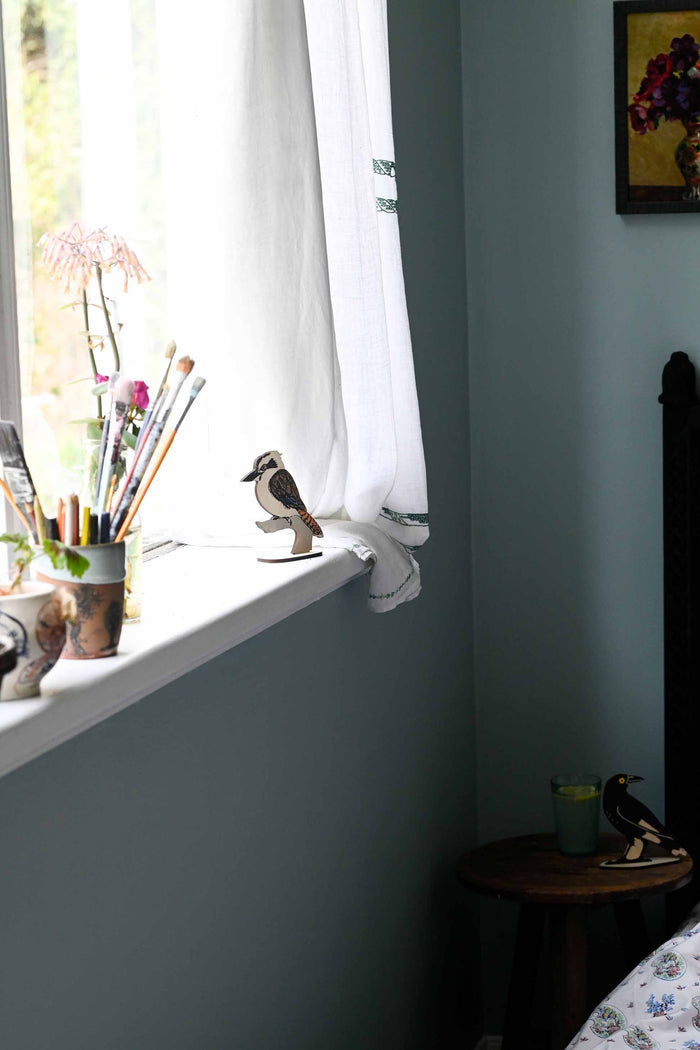 Kookaburra & Currawong figurines on windowsill