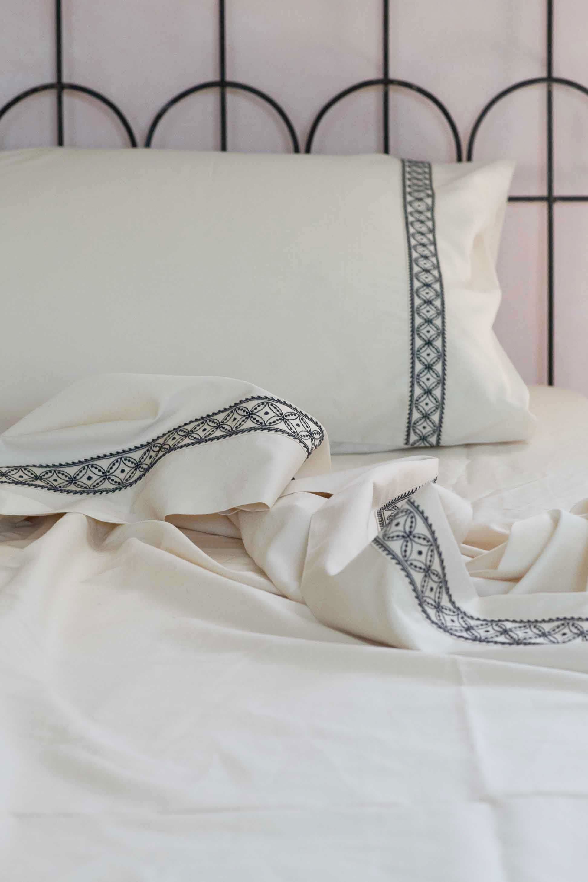 Cream-colored embroidered sheet set