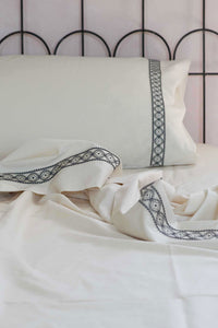 Cream-colored embroidered sheet set