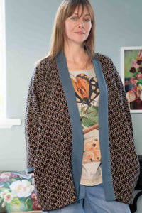 Eleanor in Lola Cardigan with insect print top and denim.