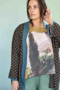 Lola Cardigan Peggy Garden Ollie Sage - woman in patterned cardigan & landscape...