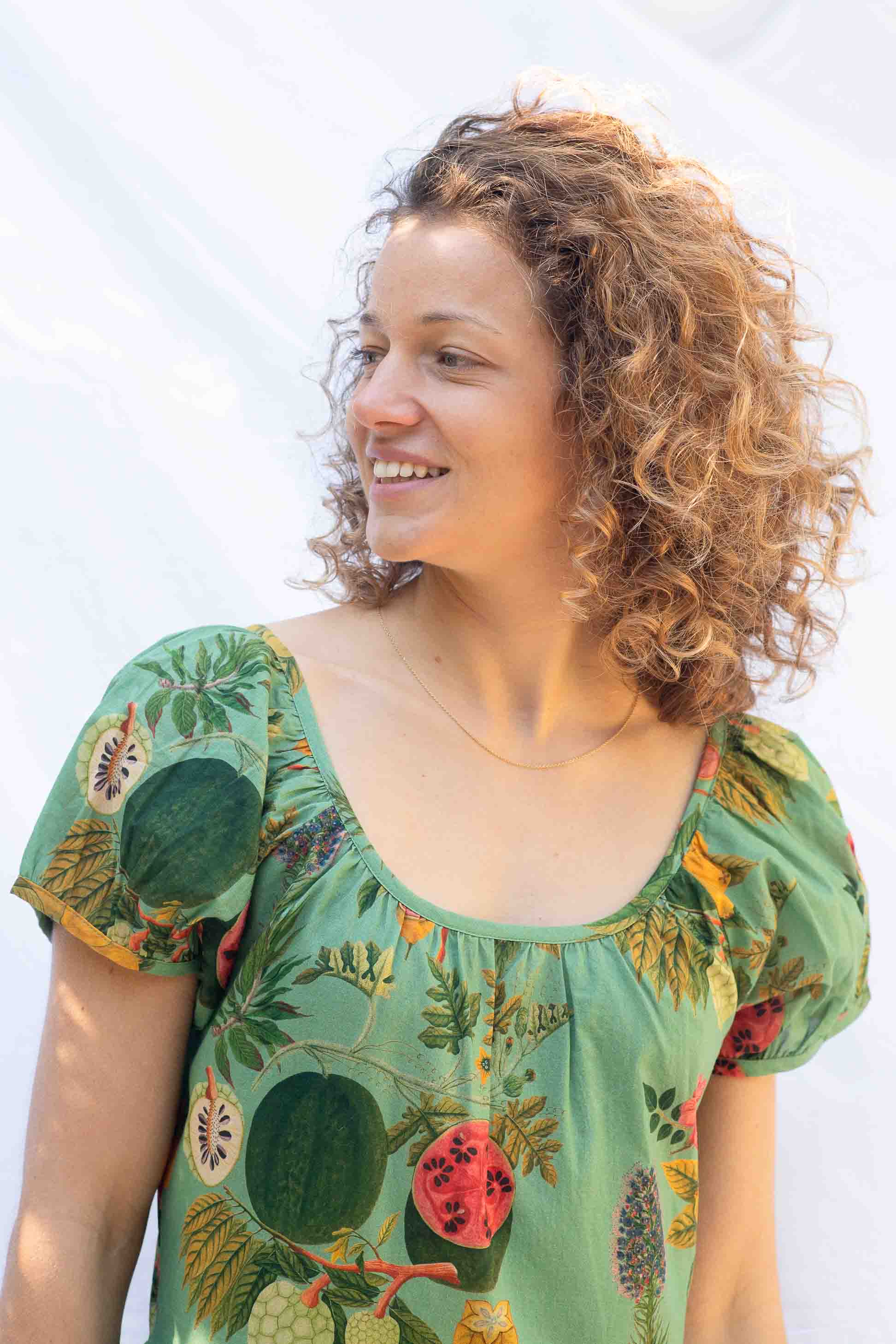 Marisa in tropical print shirt smiling