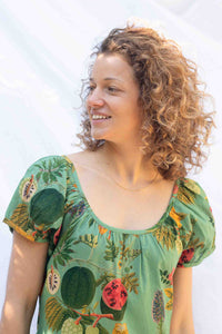 Marisa in tropical print shirt smiling