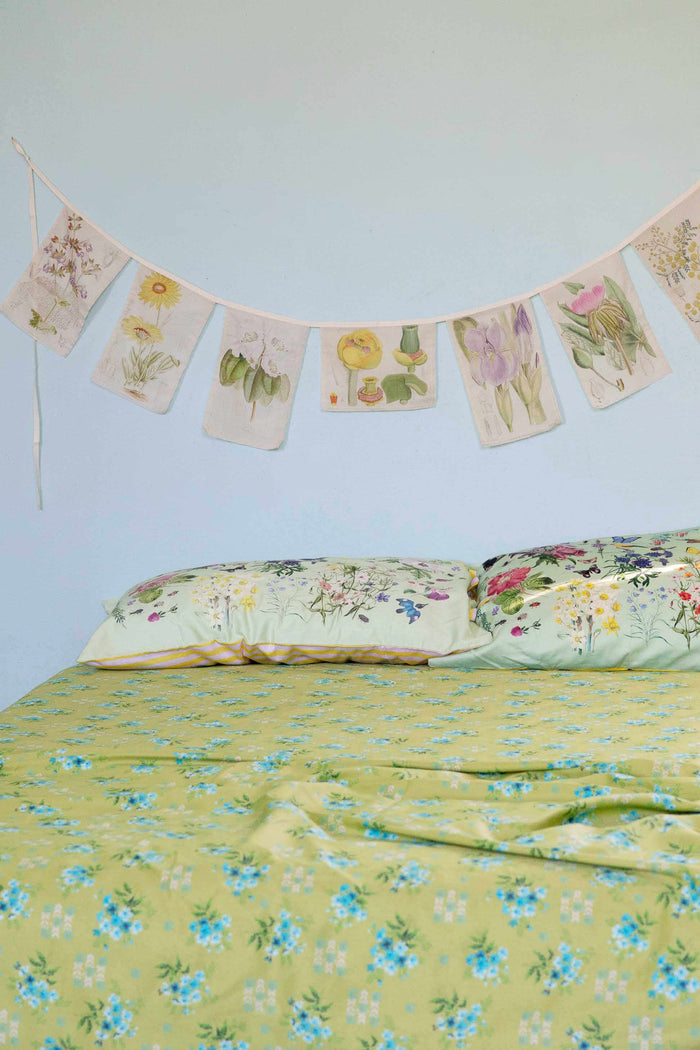 Matilda Smith Avonlea floral garland over busy garden bed
