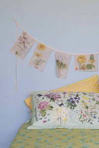 Matilda Smith Garland of floral sheets in busy garden