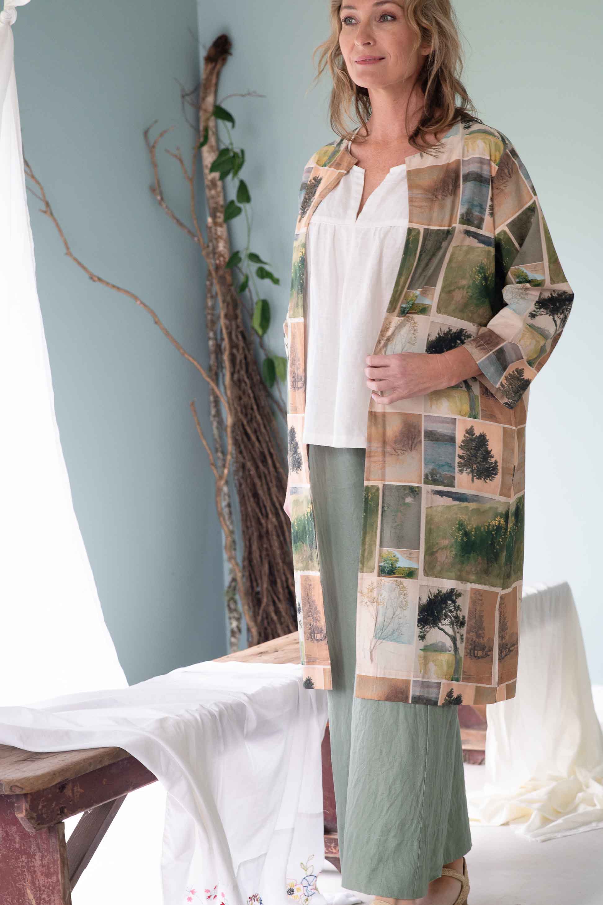 Julia White in nature-print jacket and green pants