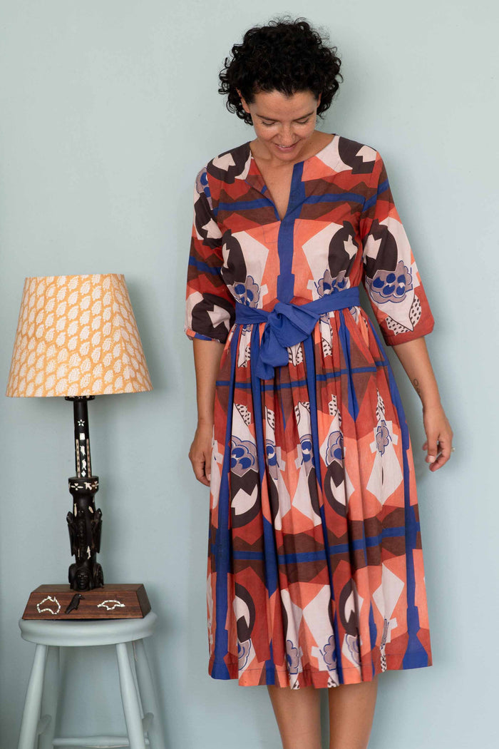 Michaela's dress composition, patterned dress with blue belt.