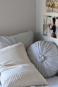 Dove euro cushion and natural pillowcase on bed