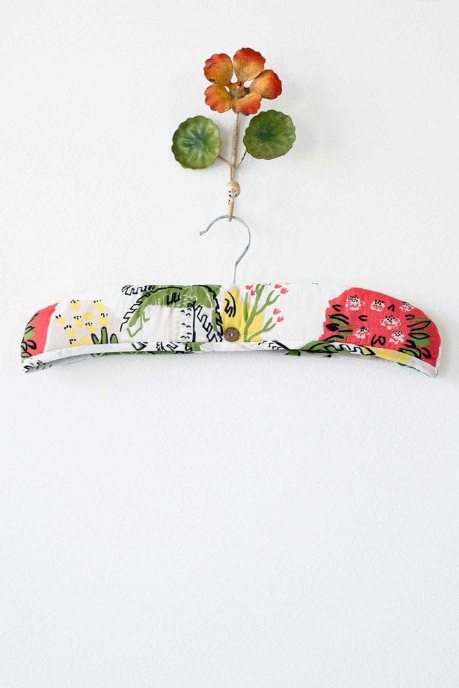 Paradise print padded hanger with floral accent