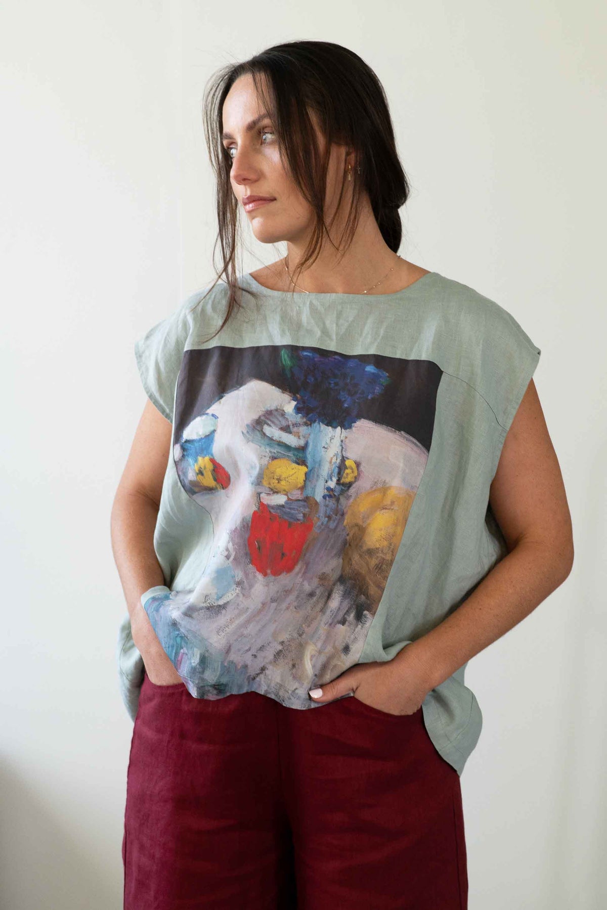 Woman wearing Peggy Still Life Ollie Red top