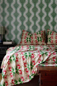 Pelargonium floral bedding set with green patterned wallpaper