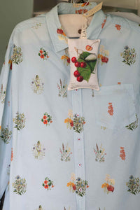 Prunus scented sachet on light blue floral shirt