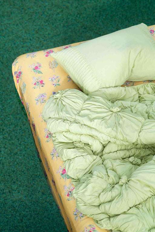 Rosette Green Tea Summerland sheets on bed