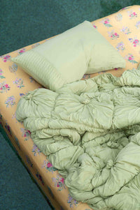 Rosette Green Tea Summerland Sheets, bed with pillow and quilt