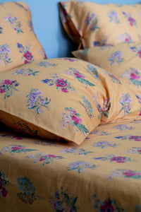 Summerland floral pillowcase on bed