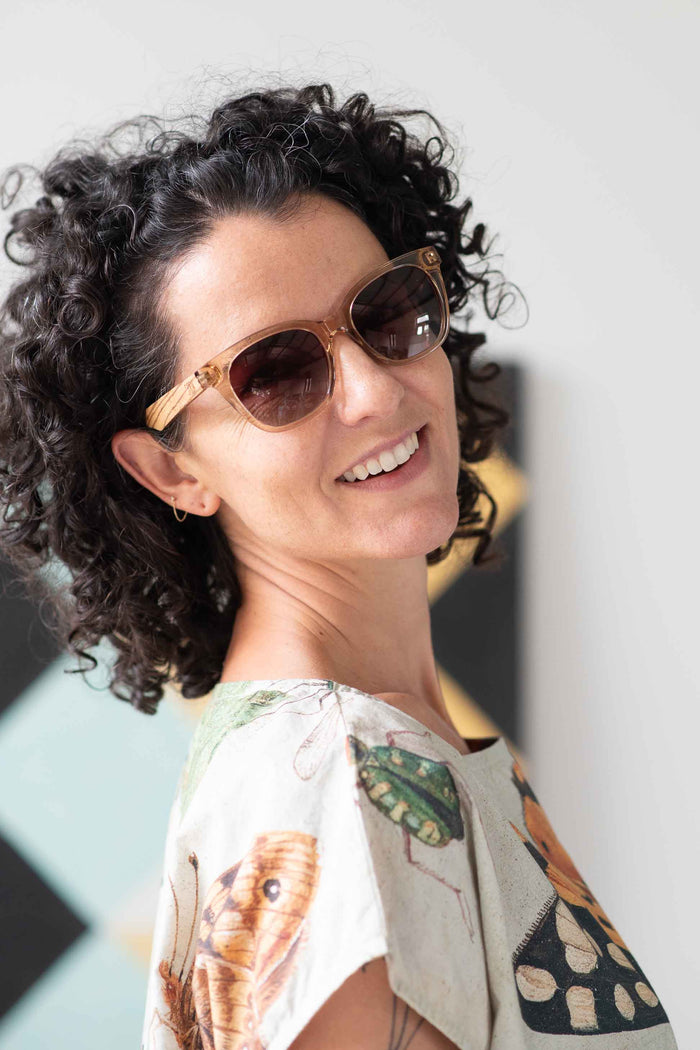 Eleanor wearing sunglasses, insects on shirt