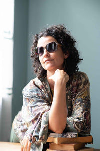 Woman in sunglasses and floral kimono
